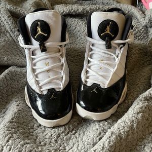Size 7Y BOYS.Black white and gold Air Jordan 6 rings.Fair condition a few scuffs
